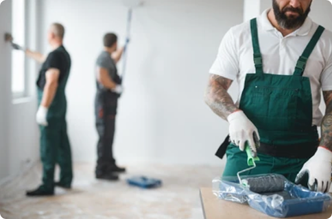 Painter working on a wall touch-up